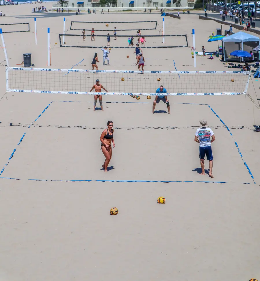 Several beach volleyball courts in play at once